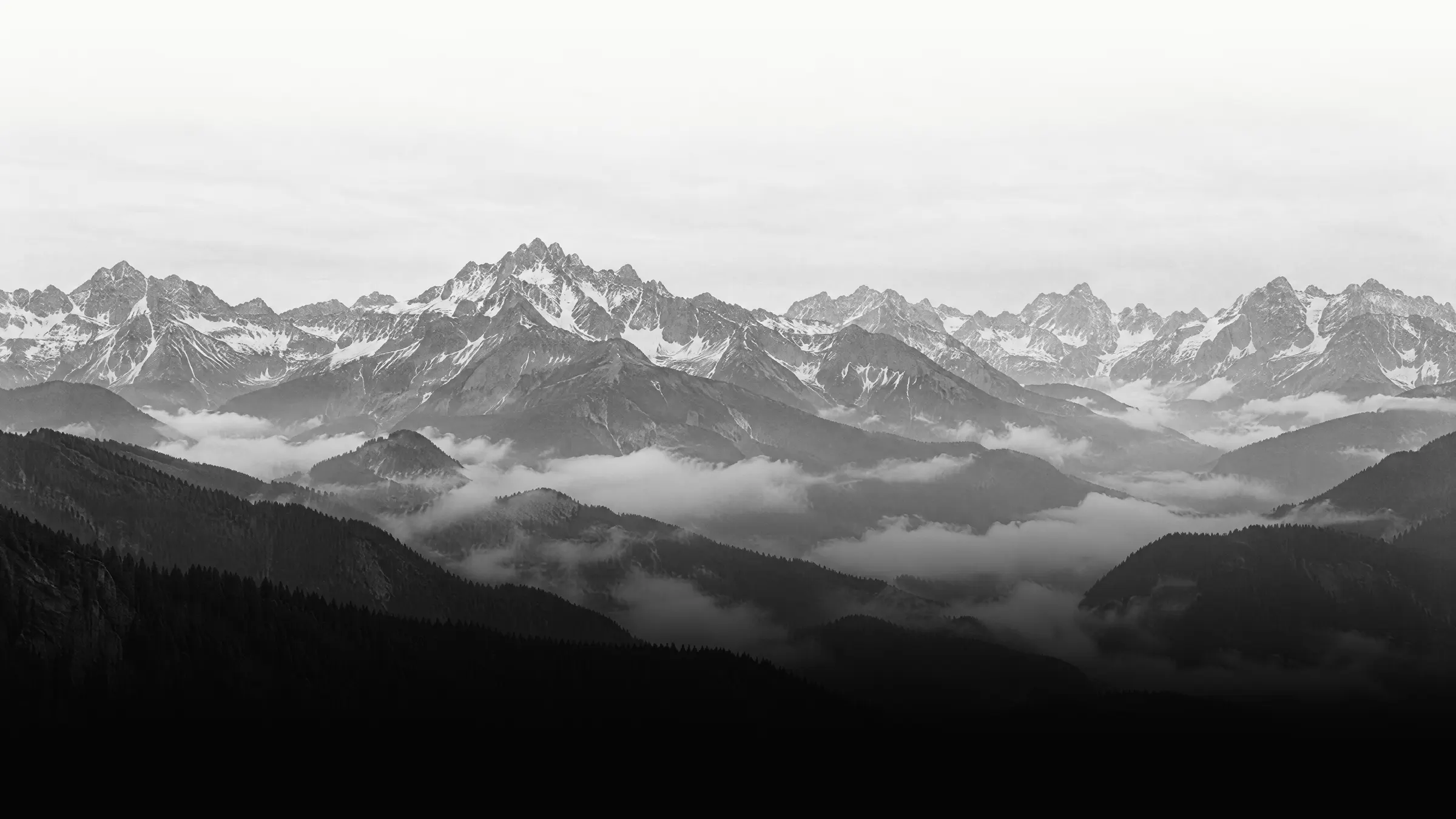 Alpine panorama with fog in the valleys