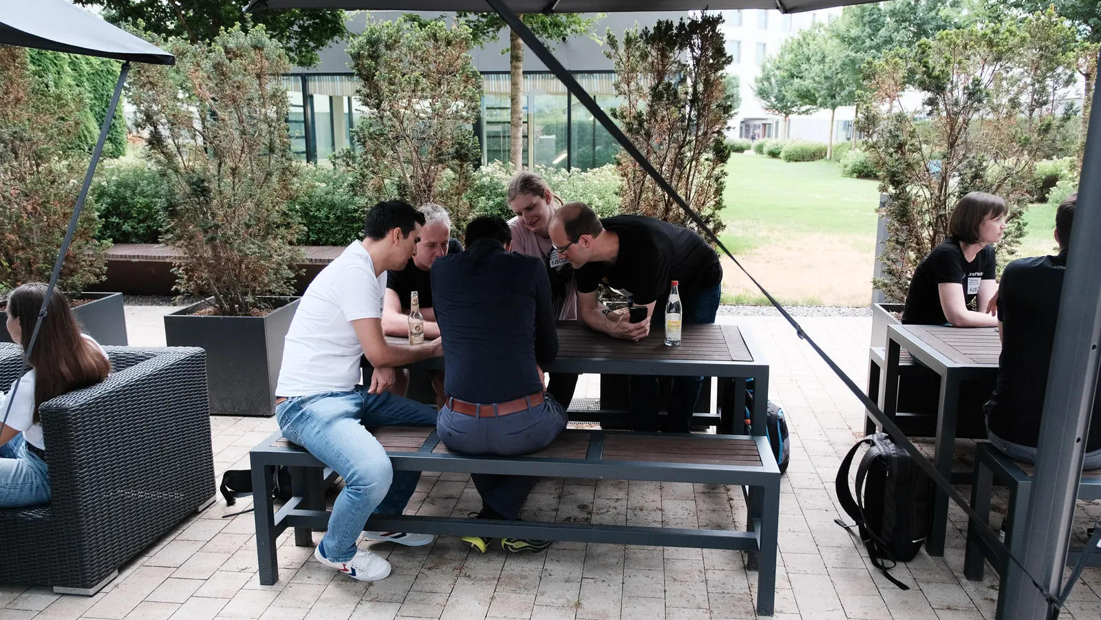 A small group talking on the terrace