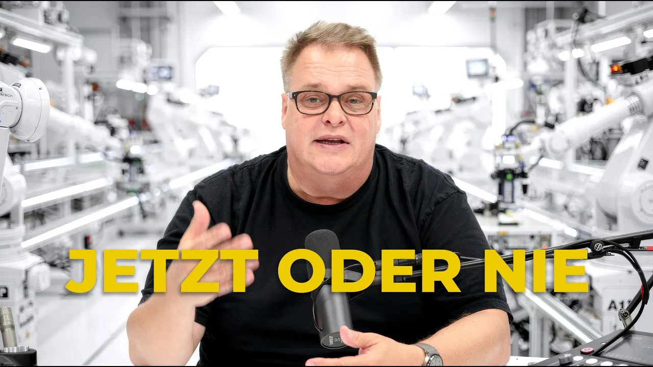Lars Thomsen speaking to camera in front of a robot production line, thumbnail “Now or never”
